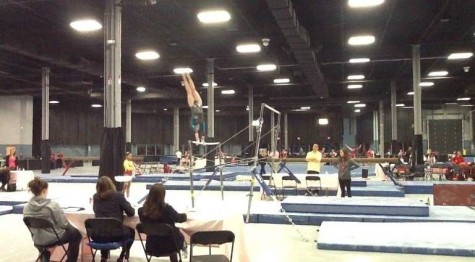 Poised here on top of the parallel bars, Struble is a high-level gymnast at sixteen years old.  