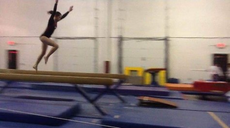 Her most nerve-wracking event -- the beam -- does not stop Struble from being graceful, as she launches here toward dismount.  