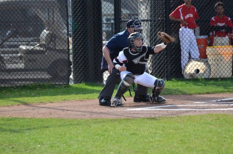 Scandale, catching a pitch during last week's season opening win against Manchester, 20-0.