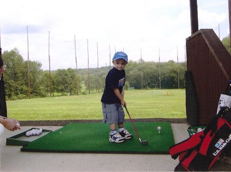 Schwendemann strikes a pose before teeing up a golf ball at the driving range.