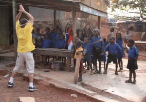 Sometimes it's best to not have a camera around your neck or on your shoulder. Here, Ken leads a bunch of pre-schoolers in Ghana, Africa, in jumping jacks during a break from shooting.