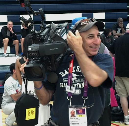 At the Olympics in London, 2012, covering a photo session with the USA Mens basketball Dream Team prior to their Gold-medal winning game.