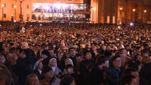 The crowd reacts to the selection of a new pope (2013).  