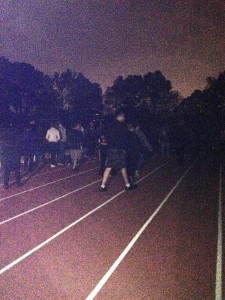 Students circle the track during their fundraising relay.  