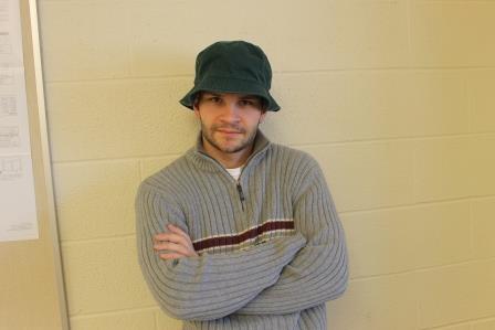 Mr. Corby brandishes the fabled, omniscient green bucket hat atop his dome. 