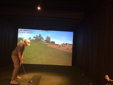 Forced into practice simulators such as this while they wait for the golf fields to open after an especially harsh winter, the Glen Rock High School golf team has tried to stay sharp.  