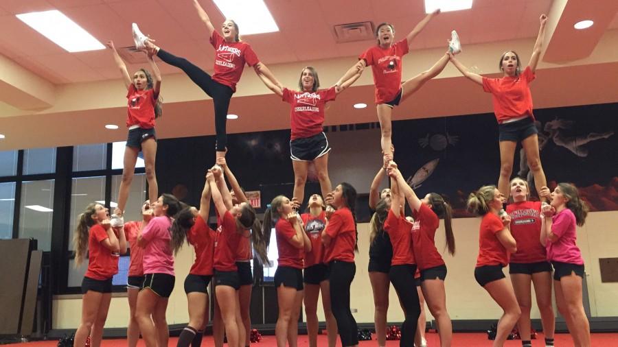 Despite the football season ending officially in mid-November, the cheerleaders remain out in full force as they practice for competitions in late November and early December.  