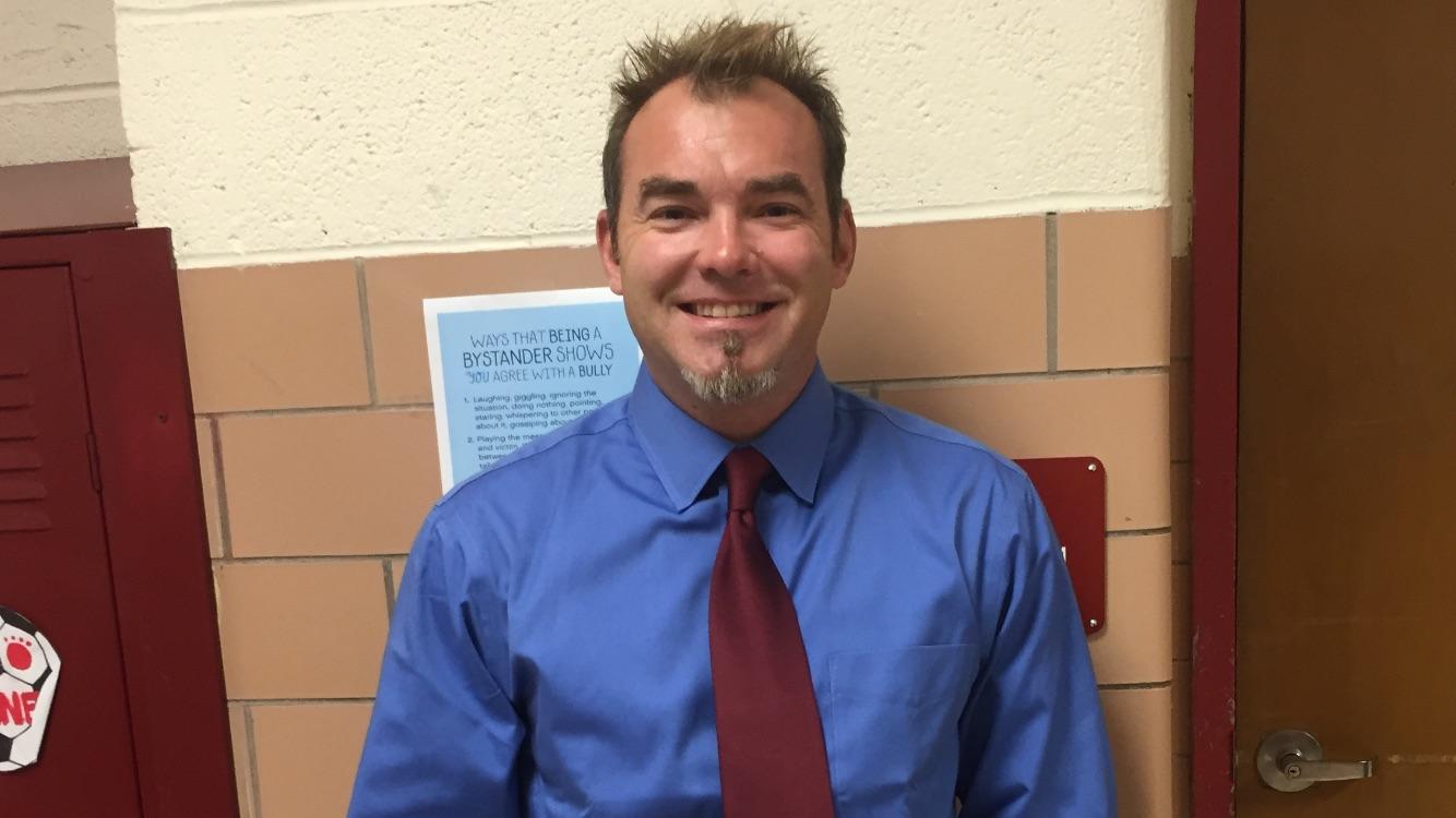 Mr. Garland, teacher assistant and previously in the FBI, walks the halls of Glen Rock High School.