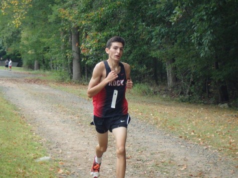 Newcomer leads team, breaks school running record