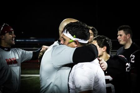 Coach Kurz congratulating Senior James Antolino.