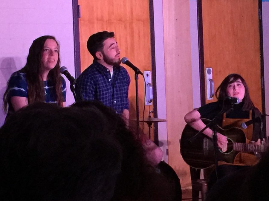 Harrison Gale, Jake Aboyoun, and Mandy Rosengren perform a song at Coffeehouse