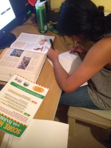 Singh is working at her desk, still striving to do well because of her upcoming AP Tests. 