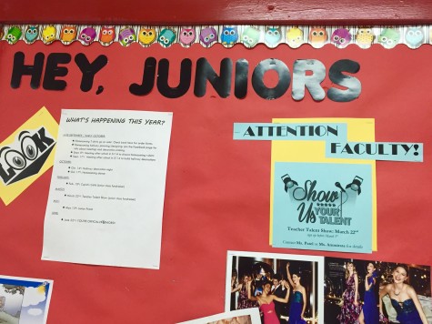 The bulletin board in the junior hallway showcasing a 2016 Teacher Talent Show advertisement. 