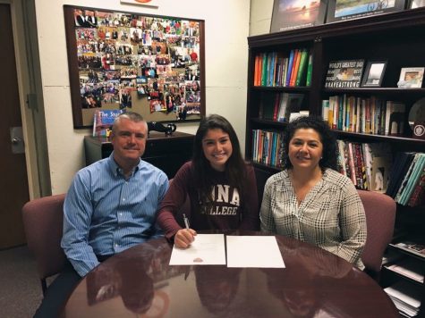 Julia and her parents, Lucy and Peter, on signing day as she committed to Iona.