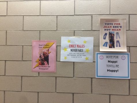 Students from Glen Rock High School post posters around the high school hallways to gain votes in the upcoming election.