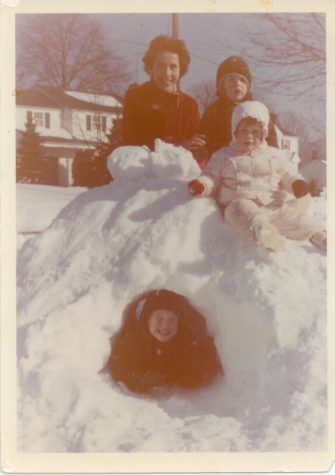  Dot Zier and three of her four children, Ron, Julie, and Ed build an igloo in the front yard of their home on Greenway Road.