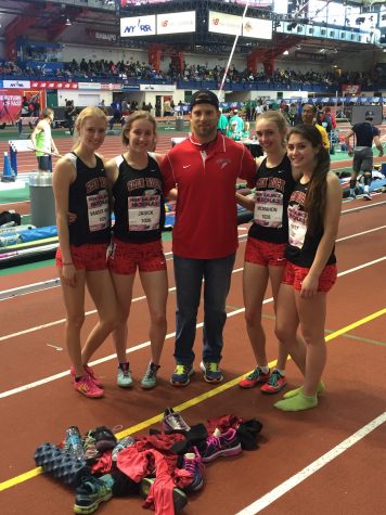 After completing their final race of the season the shuttle girls pose for a picture on the Armory.