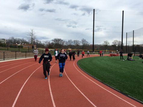 Players conversing while warming up for practice.