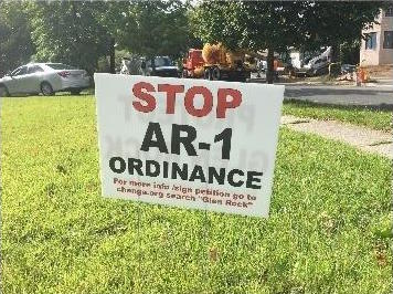 A lawn sign on Prospect Street advising people to sign a petition in protest of AR-1 Ordinance