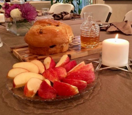 A traditional table setting for a Rosh Hashanah dinner.