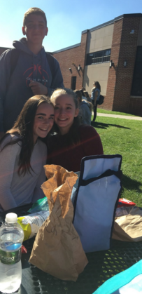 
The freshmen pose for a picture while eating lunch in the courtyard. Pictured on the top is Colin Consoli, vice president of the freshmen class this year.
