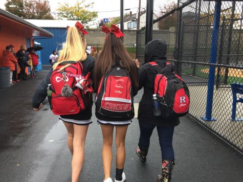 Following the breakfast, both seniors and captains, Sophia Arnao (‘17) and Caitlyn Drace (‘17) walk alongside Coach Alyssa Perry on the rainy Saturday afternoon in Lodi, New Jersey. 