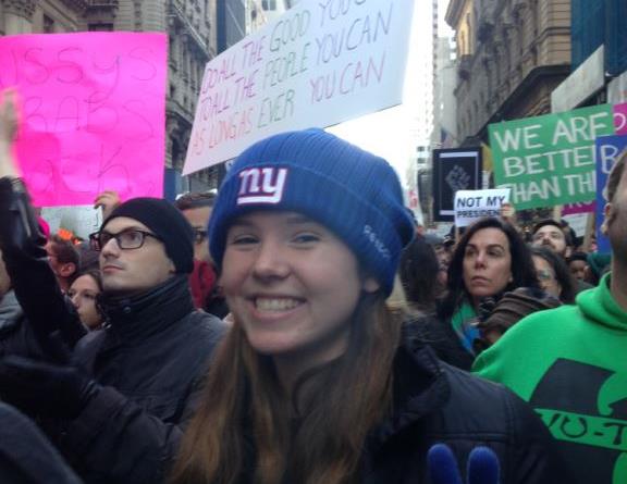 Jean Walter (18) throwing the peace sign at the anti-Trump Protest. Surrounded by people who shared a similar mindset to her,Walter described the energy at the gathering as very positive.