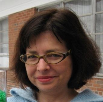 Betsy Wald smiles, reflecting on fond memories during her time at the library. 