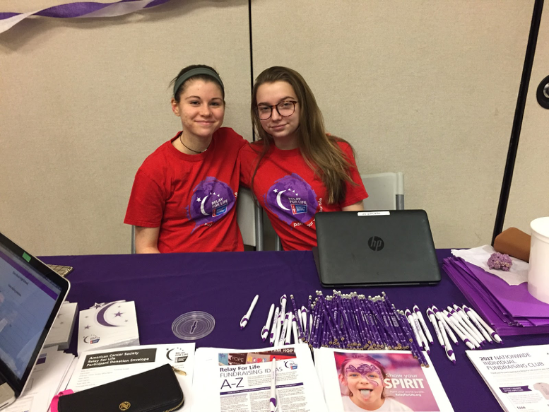 Mia Seibold and Jordan Russo, co-captains of the junior class Relay For Life team, assist those interested in participating by signing them up on the Relay For Life of Glen Rock website.