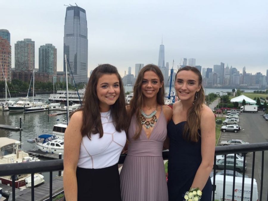 Julia Rooney (17), Megan Tatigian (17), and Jaclyn Mills (17) capture a moment during the 2016 senior prom.   