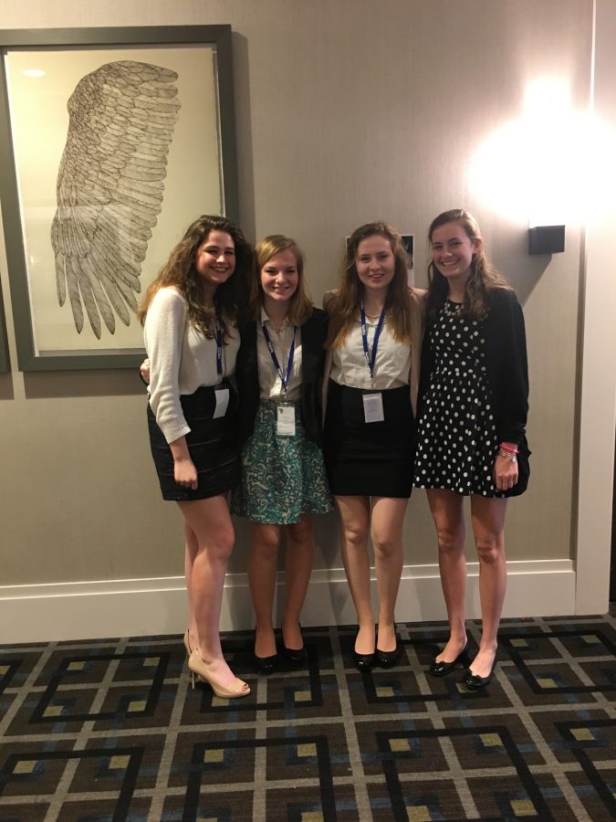 Seniors Lindsay Vachon, Nina Dunn, Erin Dunn, and Emily Schaefer pose for a picture after a committee session at their last Model UN Conference in High School. “I’ve been in this club since freshman year, I joined for fun, but I’m sad it’s my last trip with Model UN,” Schaefer said. 
