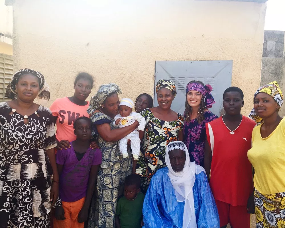 Anna posing with her host family. Even though her family looks unhappy, they aren’t. Senegalese people have the tendency to not smile in photographs.
