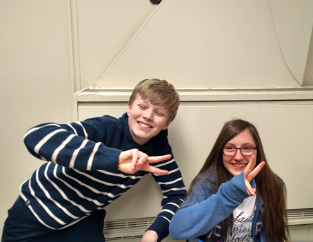 Noah poses with classmate Marie Lescouet. Both students are immigrants from other countries.