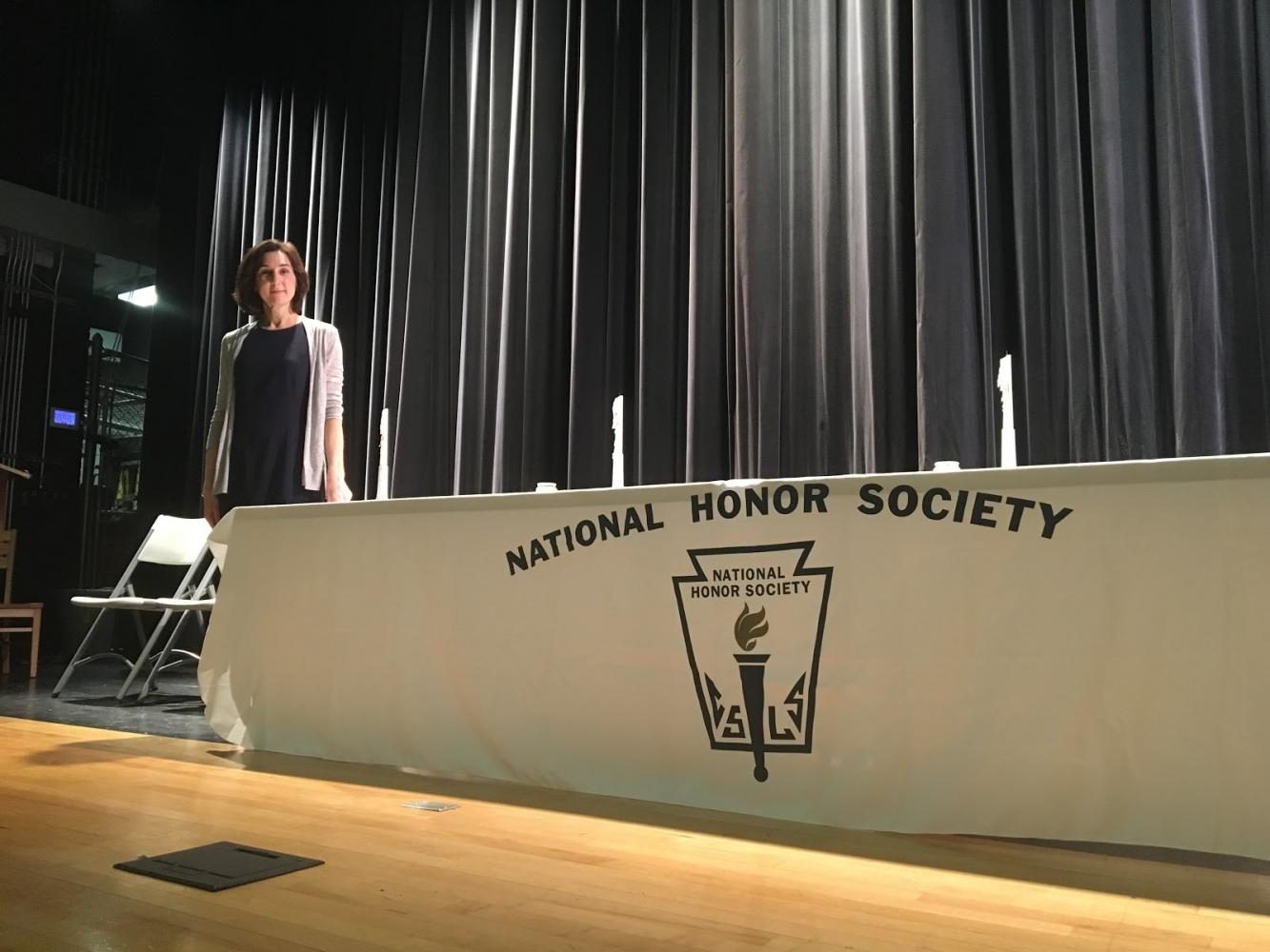 National Honor Society adviser, Donna Maasarani poses for a photo after the induction ceremony. 