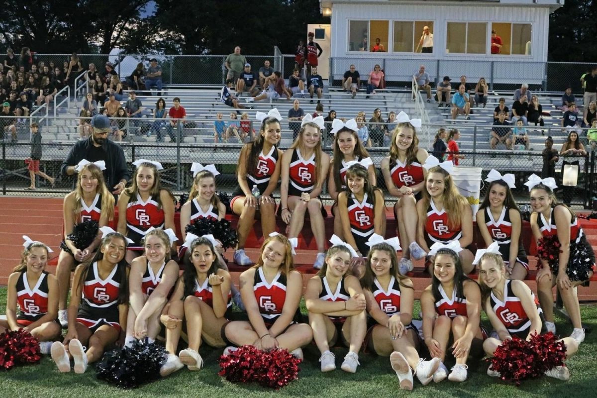 The 2017 varsity cheerleading members pose in their new uniforms at the game against Manchester on Sept. 15. 