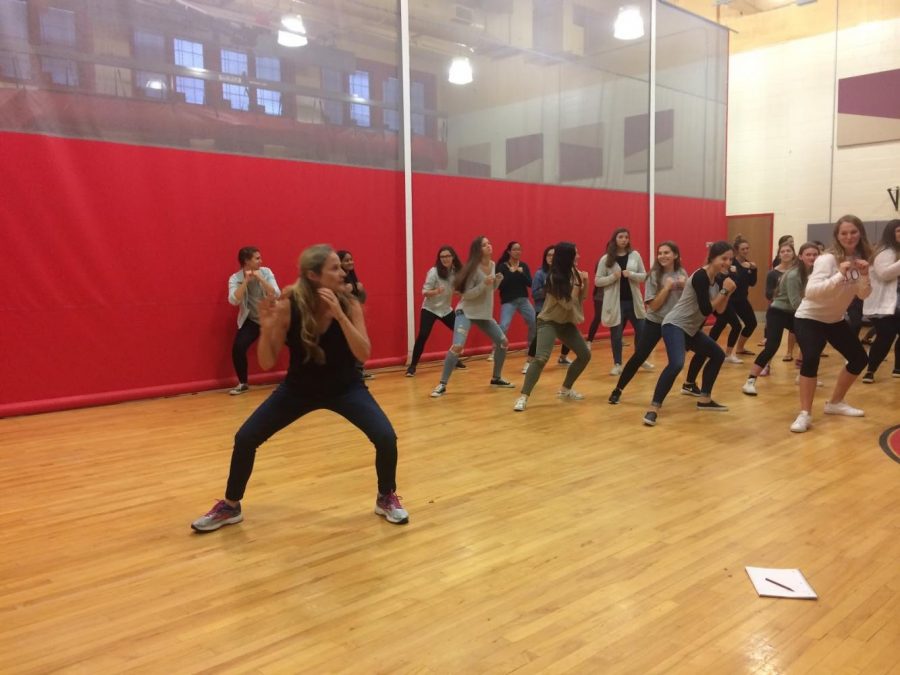 On the morning of October 12, self-defense expert Jennifer Cassetta teaches senior girls how to defend themselves against a potential attacker. She demonstrated how to base out to increase ones balance when defending themselves. 