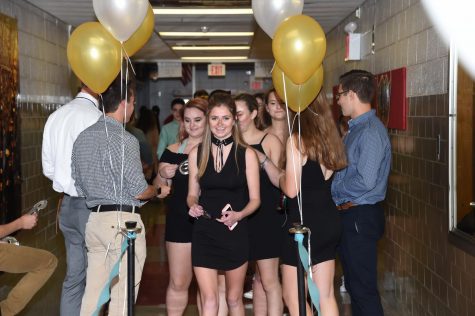 More than 300 students wait in line to enter the homecoming dance.