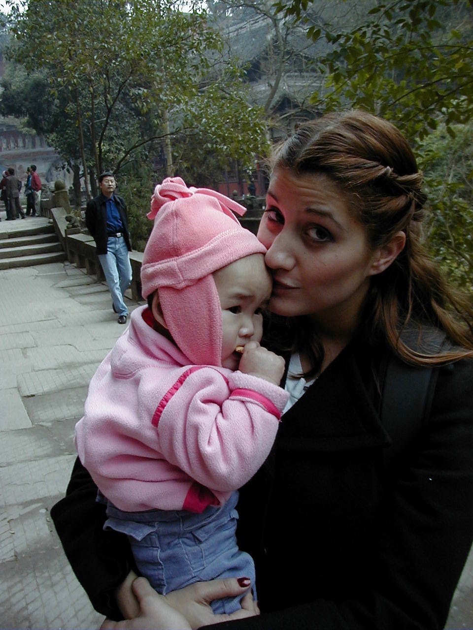 Grace's oldest sister Laura poses for a picture with her newest sibling in January 2003, when the Huisking family picked up Grace from the orphanage in China.