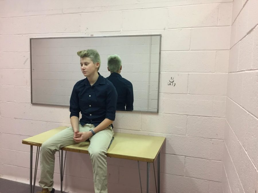 Adam Dietrich sits in the girls bathroom after school hours at Glen Rock High School.  Adam has helped the school community understand what it means to be a transgender person. 