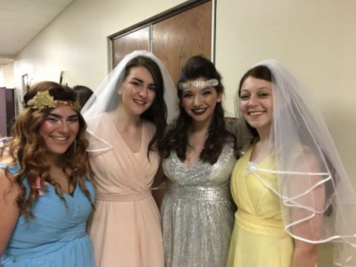 Madison Jones (far right) poses with fellow seniors during the dress rehearsal for A Midsummer Night’s Dream.  She acted as a second opinion for her peers when working a scene as well as being their scene-partners.  Frankie Fontana, Tina Rivara, and Caroline Koenig joined Jones for a picture after the dress rehearsal.