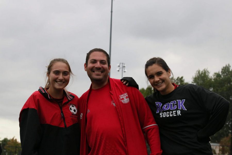 Toffell poses with girls varsity soccer captains, Camille Juliana (‘18) and Olivia Trapaghen (‘18). Toffell is said to have an amazing relationship with both players and coaches along with being super interactive with the crowd no matter the sport.