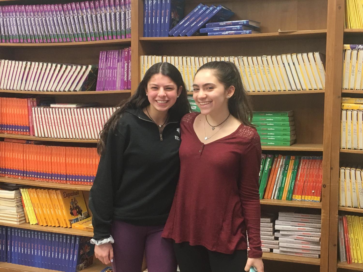 Club president Abby Stern stands with Hailey Sapoff, student outreach officer, at the end of the last Girl Up meeting.