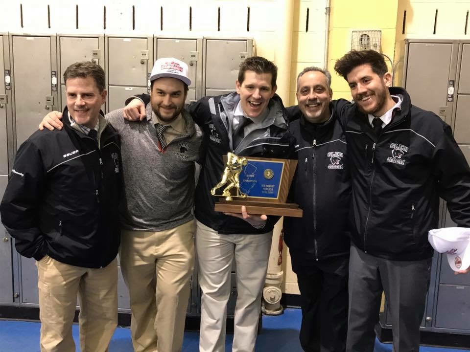 Glen Rock Varsity Coaching staff poses with the State Championship, after an 8-1 victory over Wall Township. From left to right Sergio Fernandez, Zane Kalemba, Anthony Yelovich, Frank Del Tuffo, and Dillon Driver.