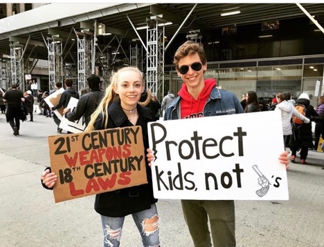 Glen Rock juniors Sarah Hutchins (left) and Matt Shiels (right) protest in New York City.