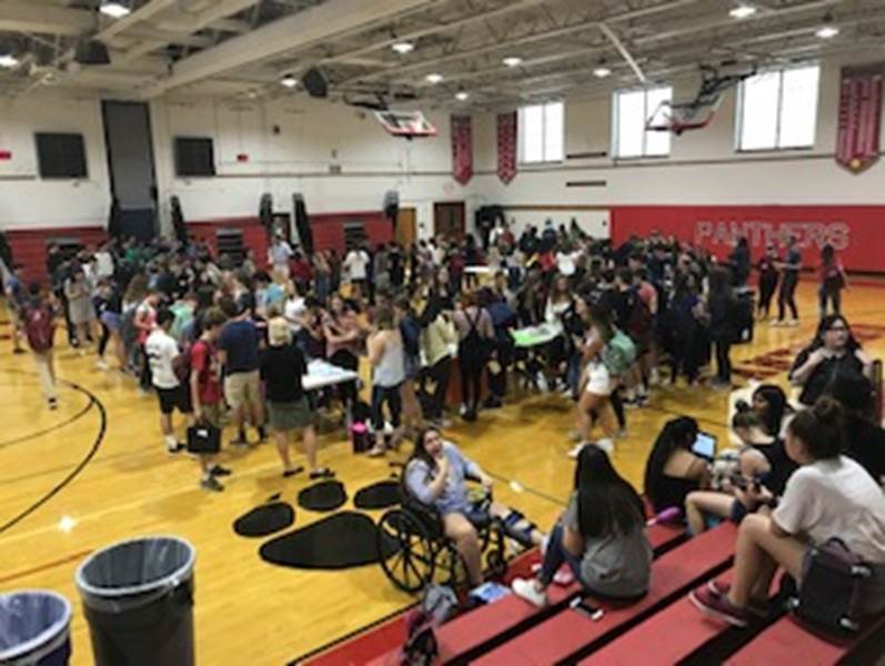 Students look at extracurriculars at the recent Club Walkaround that happened last Wednesday September 12, 2018. The picture displays the Club Walkaround and the students in the gym at that time. 
