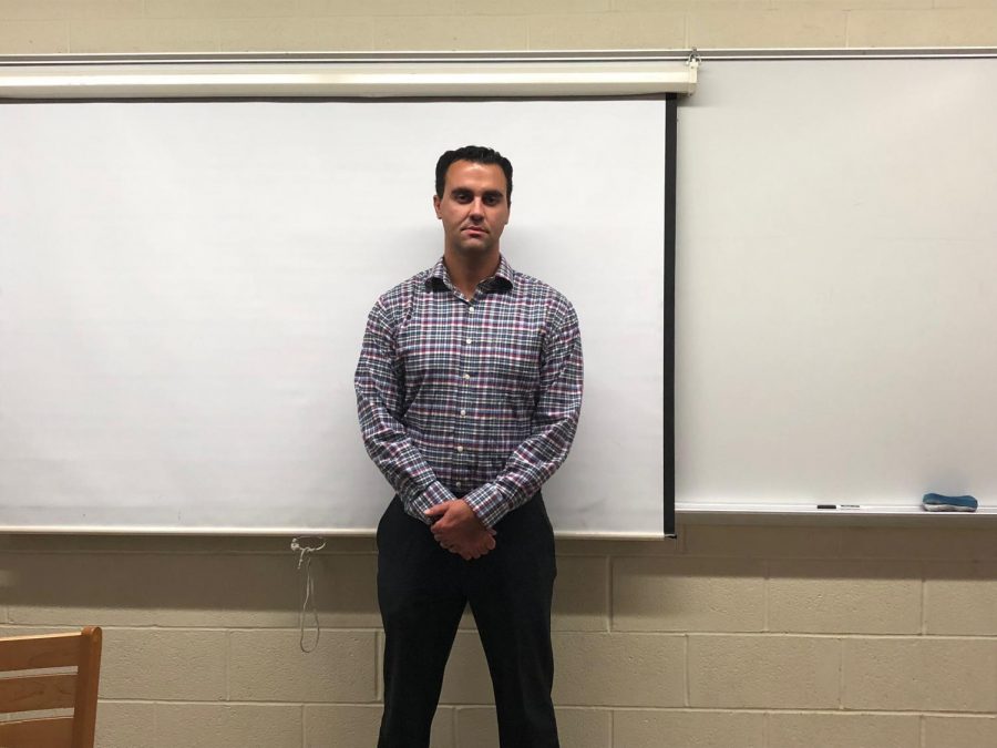 Mr Crispino is a teacher at Glen Rock preparing for class. In addition to being a teacher, he has been a baseball coach for the past nine years.