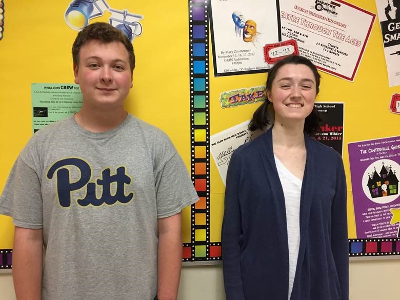 Seniors Andrew Bober and Zoe Shea pose in front of the Theatre Company bulletin board. They are playing Mr. Darcy and Elizabeth Bennet. The bulletin board has been redecorated this year by Theatre Company students. 