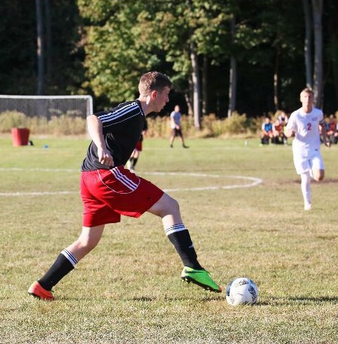 Senior defender,Wyatt Milbrodt, receives a pass in a scrimmage this summer.