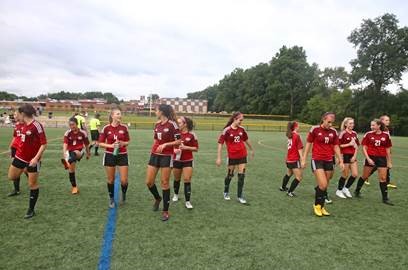 The girls get warmed up before their game. This game took place on September 28 against Midland Park.