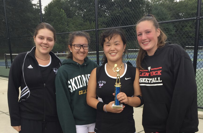 Shown from left to right are varsity tennis captains Grace Desalvo, Charlotte Arehart, Emma Mangino, and Ashley Robinson after the counties game. 
